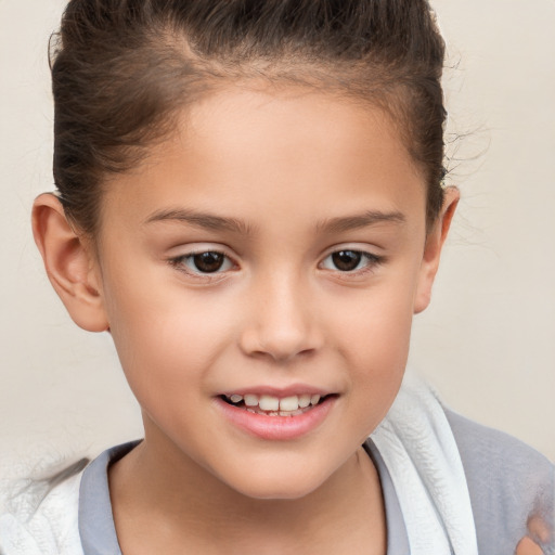 Joyful white child female with short  brown hair and brown eyes