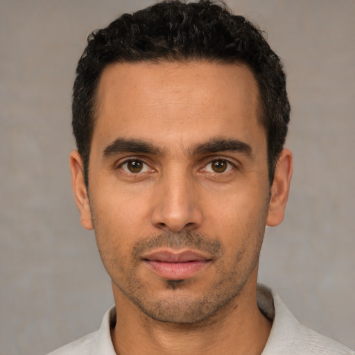 Neutral white young-adult male with short  black hair and brown eyes