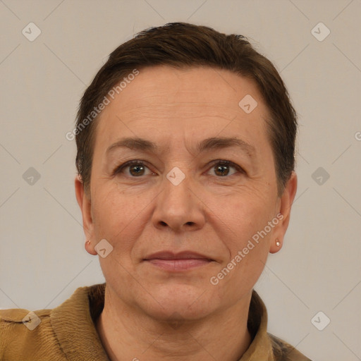 Joyful white adult female with short  brown hair and brown eyes