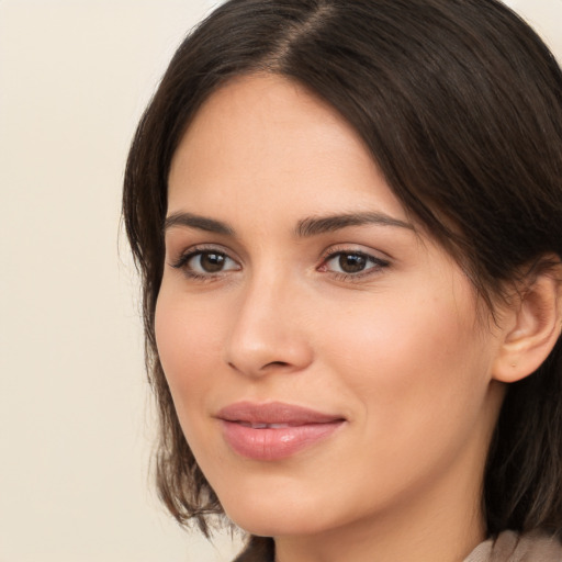 Joyful white young-adult female with medium  brown hair and brown eyes