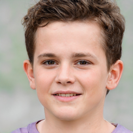 Joyful white child male with short  brown hair and brown eyes