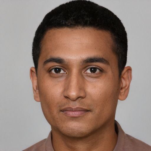 Neutral latino young-adult male with short  black hair and brown eyes