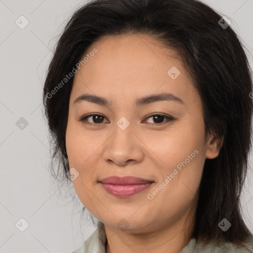 Joyful asian young-adult female with long  brown hair and brown eyes