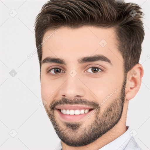 Joyful white young-adult male with short  brown hair and brown eyes