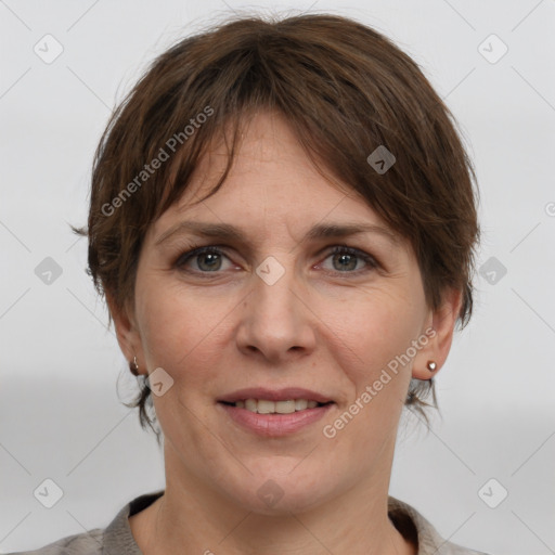 Joyful white adult female with medium  brown hair and grey eyes