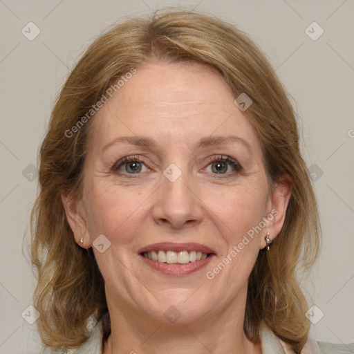 Joyful white adult female with medium  brown hair and grey eyes