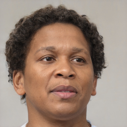 Neutral black adult female with short  brown hair and brown eyes