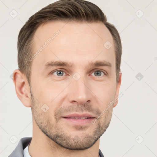 Joyful white adult male with short  brown hair and grey eyes