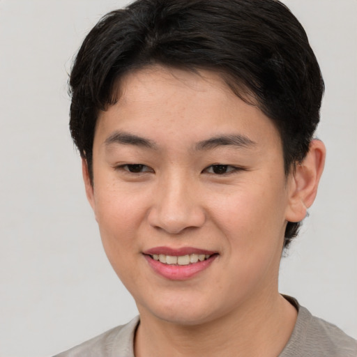 Joyful white young-adult female with short  brown hair and brown eyes