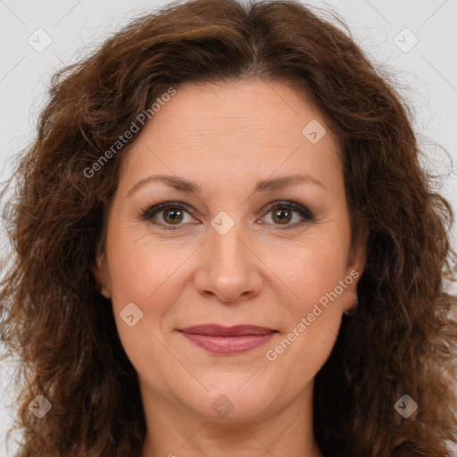 Joyful white adult female with long  brown hair and brown eyes