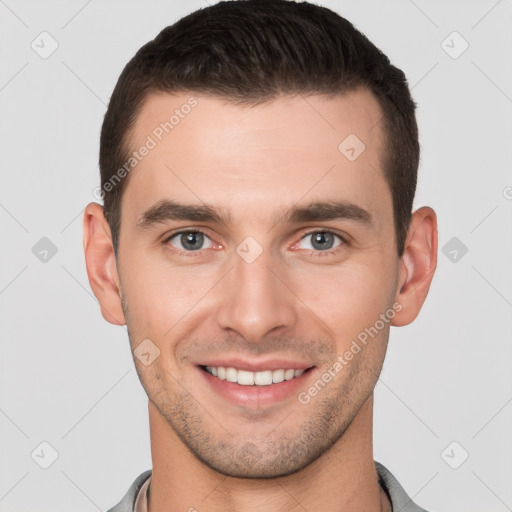 Joyful white young-adult male with short  brown hair and brown eyes