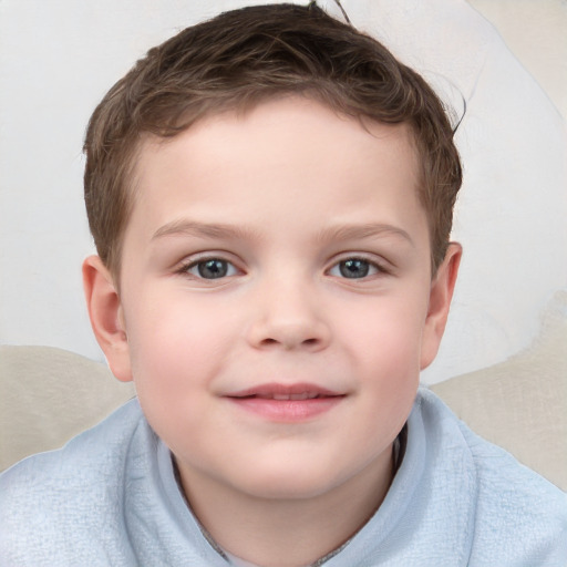 Joyful white child male with short  brown hair and brown eyes