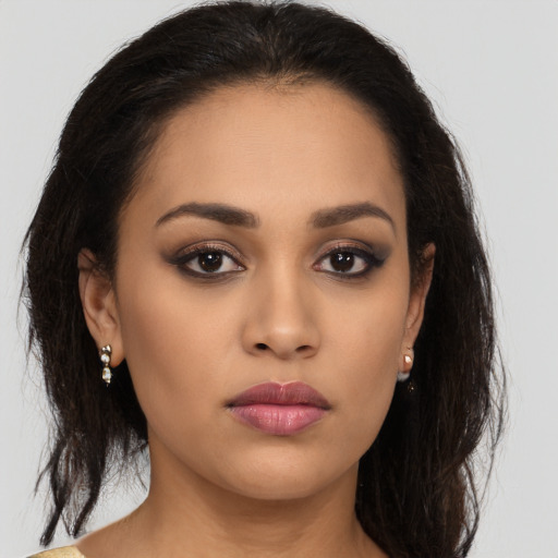 Neutral latino young-adult female with medium  brown hair and brown eyes