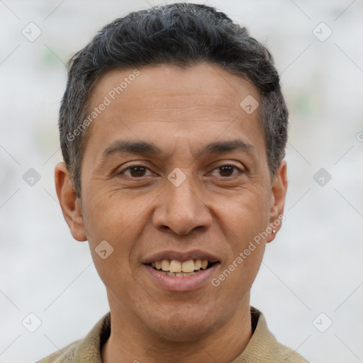 Joyful asian adult male with short  brown hair and brown eyes