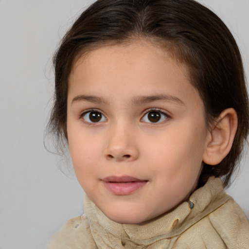 Joyful white child female with medium  brown hair and brown eyes