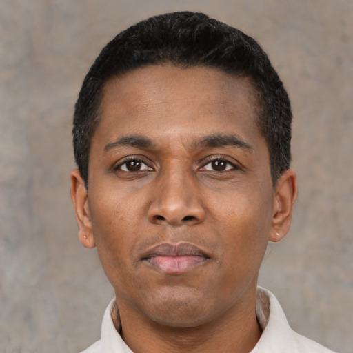 Neutral latino young-adult male with short  black hair and brown eyes