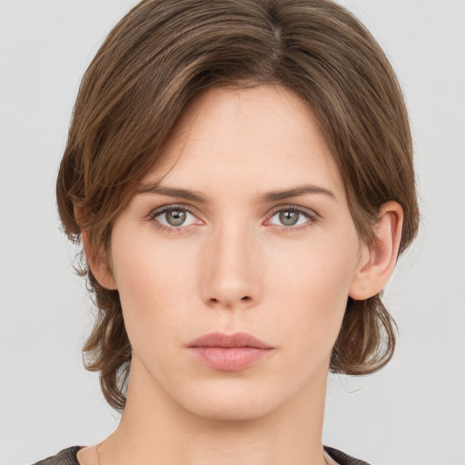 Neutral white young-adult female with medium  brown hair and grey eyes