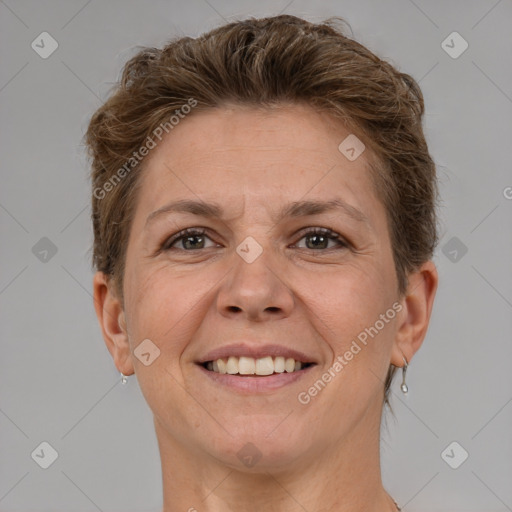 Joyful white adult female with short  brown hair and brown eyes