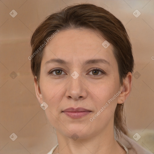 Joyful white adult female with medium  brown hair and brown eyes