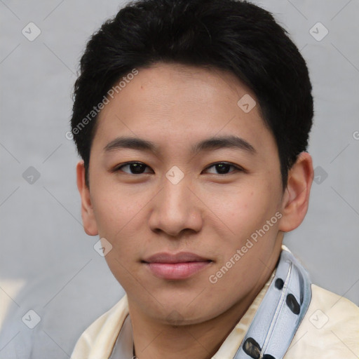 Joyful asian young-adult male with short  black hair and brown eyes