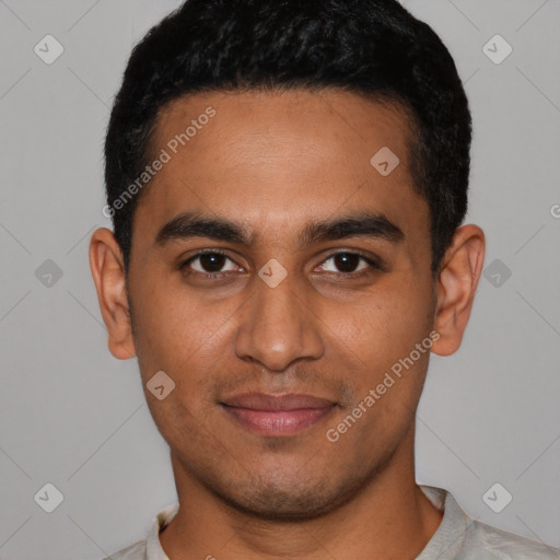 Joyful latino young-adult male with short  black hair and brown eyes