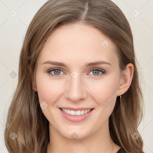 Joyful white young-adult female with long  brown hair and grey eyes