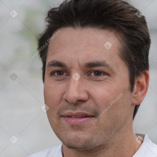 Joyful white adult male with short  brown hair and brown eyes