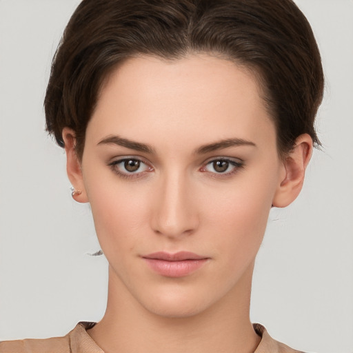 Neutral white young-adult female with short  brown hair and brown eyes