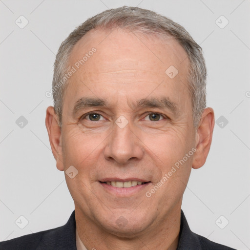 Joyful white middle-aged male with short  gray hair and brown eyes