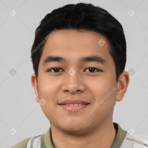 Joyful asian young-adult male with short  black hair and brown eyes