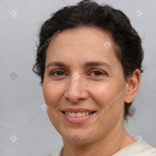 Joyful white adult female with short  brown hair and brown eyes