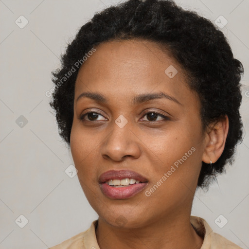 Joyful black adult female with short  brown hair and brown eyes