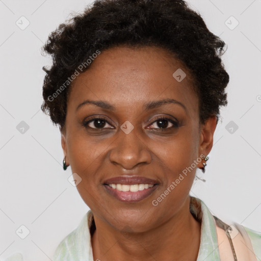 Joyful black adult female with short  brown hair and brown eyes