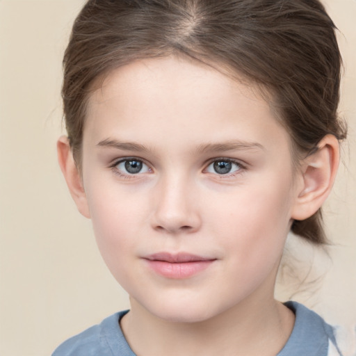 Joyful white child female with short  brown hair and brown eyes