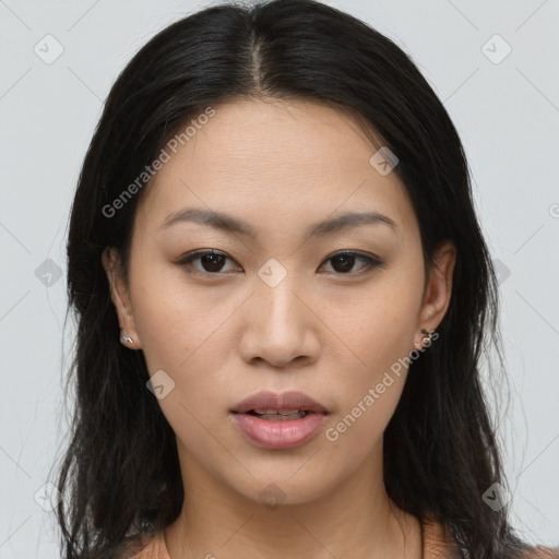 Joyful asian young-adult female with long  brown hair and brown eyes