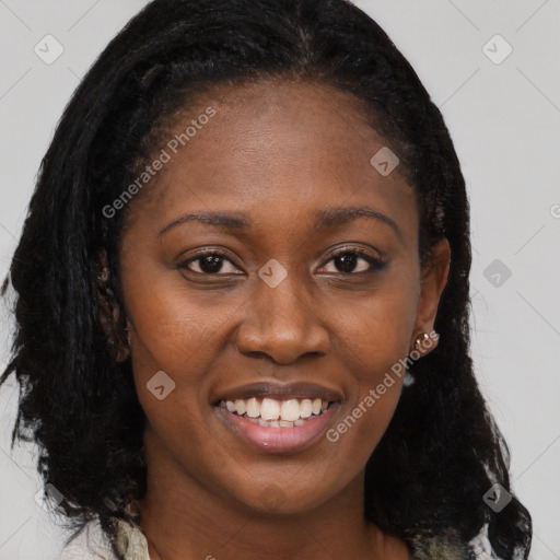 Joyful black young-adult female with long  brown hair and brown eyes