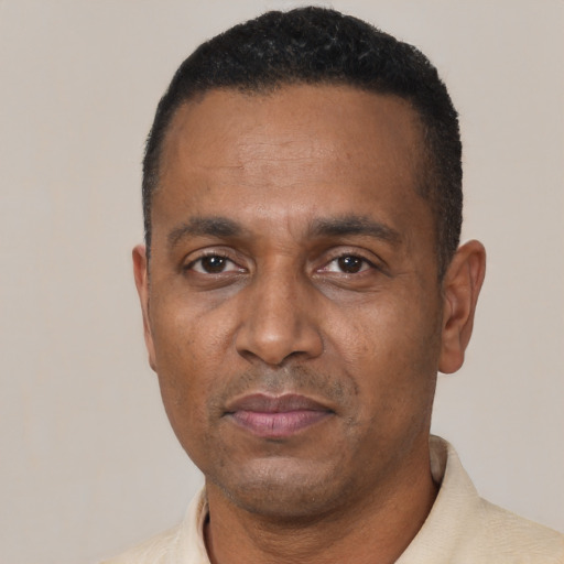 Neutral black adult male with short  black hair and brown eyes