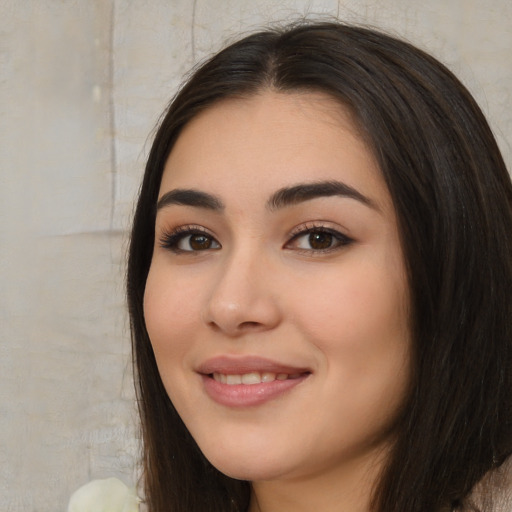 Joyful white young-adult female with long  black hair and brown eyes