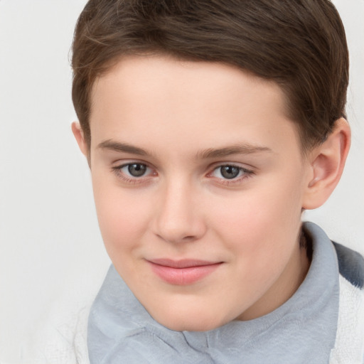 Joyful white child female with short  brown hair and brown eyes