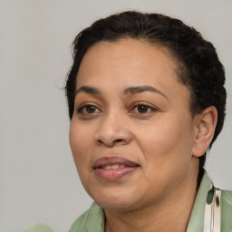 Joyful white adult female with short  brown hair and brown eyes