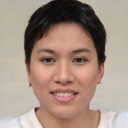 Joyful asian young-adult female with short  brown hair and brown eyes