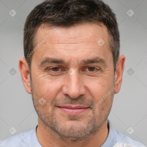 Joyful white adult male with short  brown hair and brown eyes