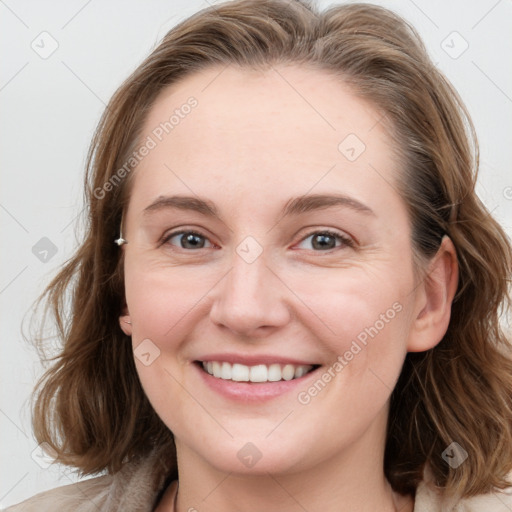 Joyful white young-adult female with medium  brown hair and blue eyes