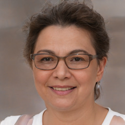 Joyful white adult female with short  brown hair and brown eyes