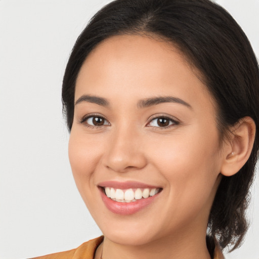 Joyful white young-adult female with medium  brown hair and brown eyes