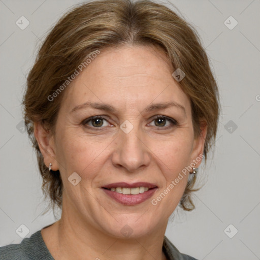 Joyful white adult female with medium  brown hair and grey eyes