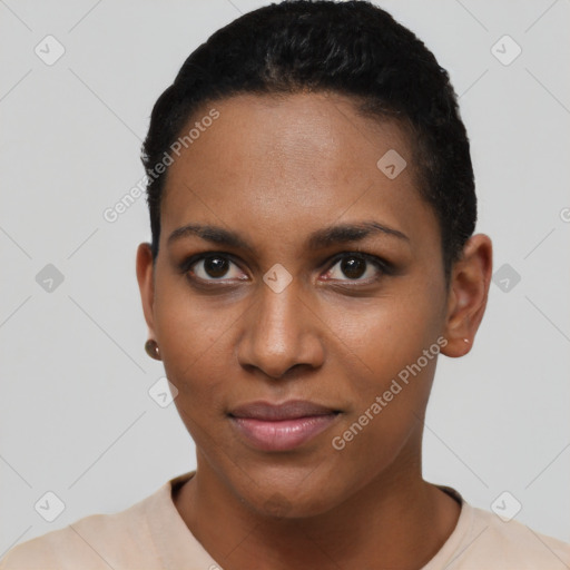 Joyful black young-adult female with short  brown hair and brown eyes