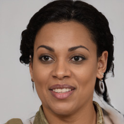 Joyful black young-adult female with medium  brown hair and brown eyes