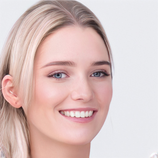 Joyful white young-adult female with long  blond hair and blue eyes