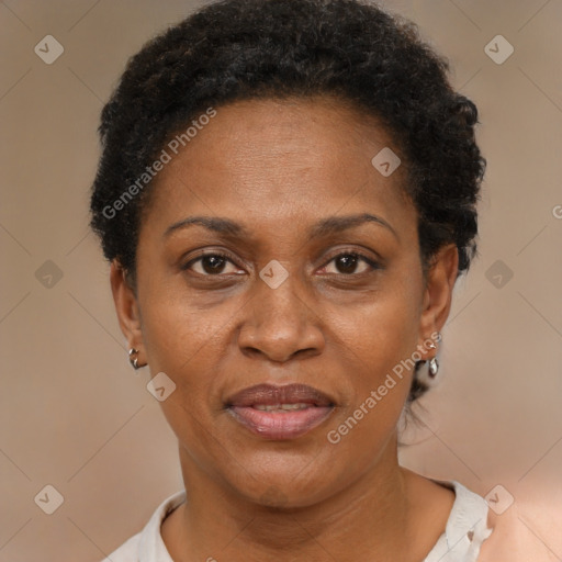 Joyful black adult female with short  brown hair and brown eyes